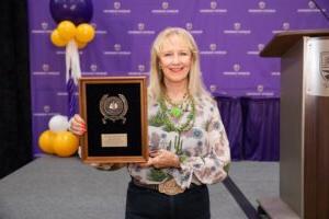 Debbie Jones holds her award.